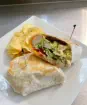 Enjoy a chicken wrap with potato chips